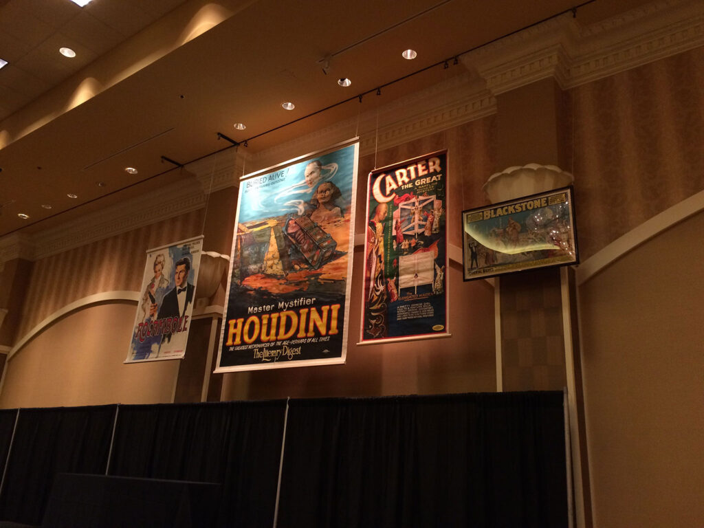 We hung posters above our booth on Saturday morning, one day before the event.