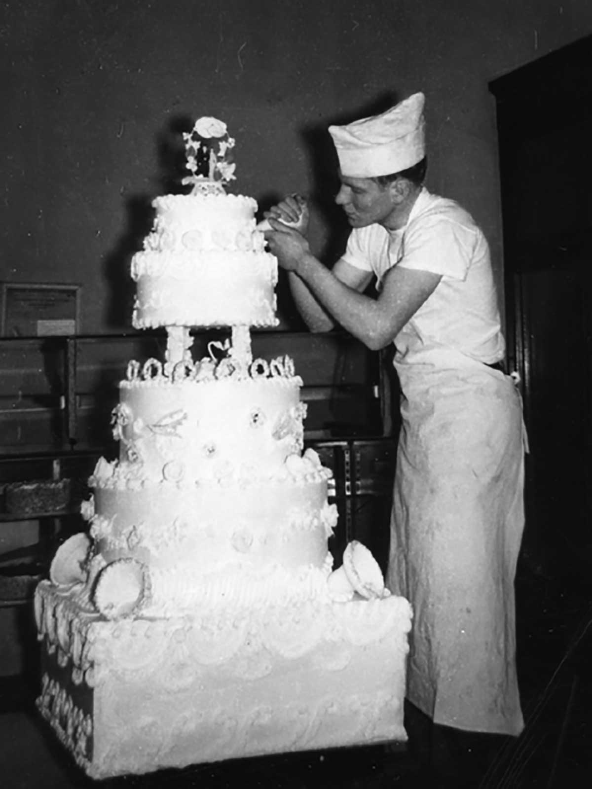 Norm decorating a cake